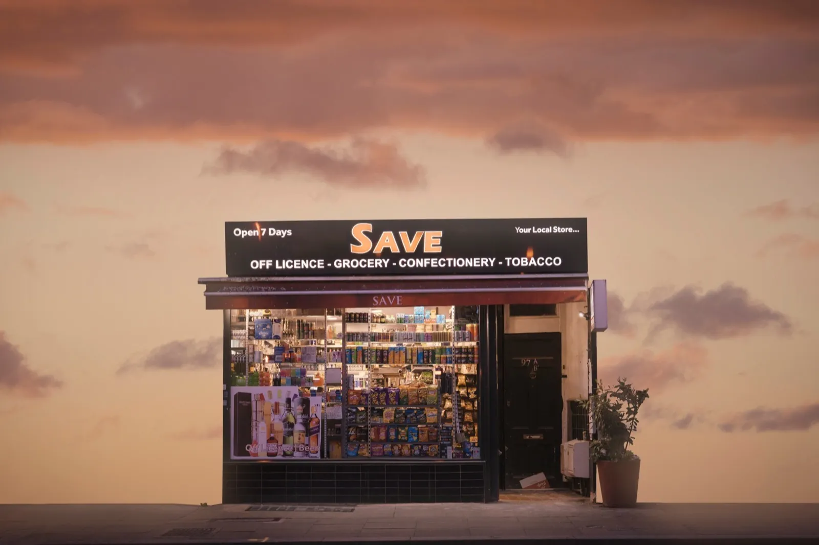 An independent local convenience store at dusk